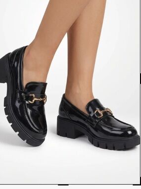 Cult Avenue Black Patent Loafers with Gold Bit and Lug Sole
